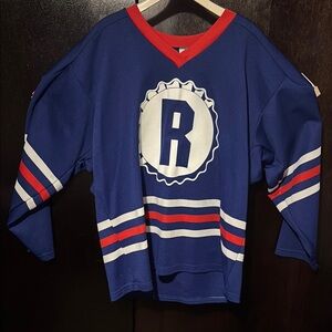 Blue and Red Hockey Jersey with Retro Mountain Dew logo on back.